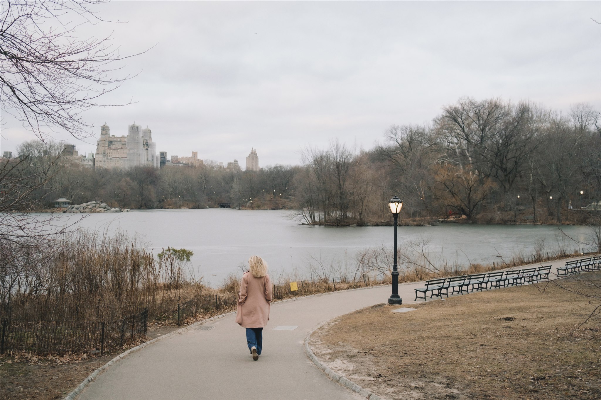 Woman walking through Central Park in New York City