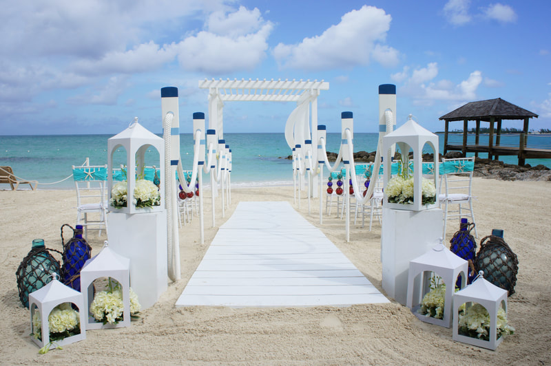 Nautical themed beach wedding at Sandals Royal Bahamian Resort.