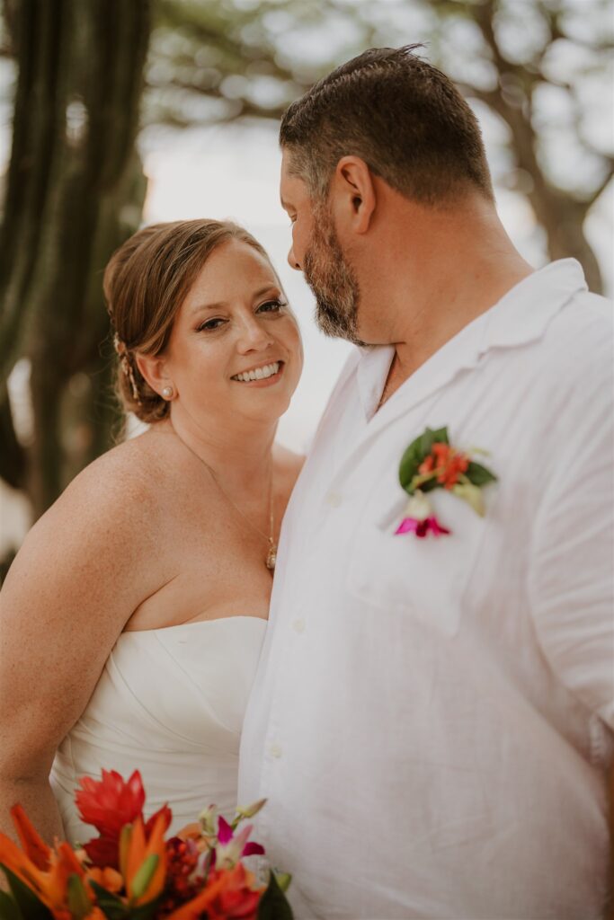 Real Destination Wedding Couple Jenn and Dan at Dreams Las Mareas Costa Rica bride and groom with cactus on the beach