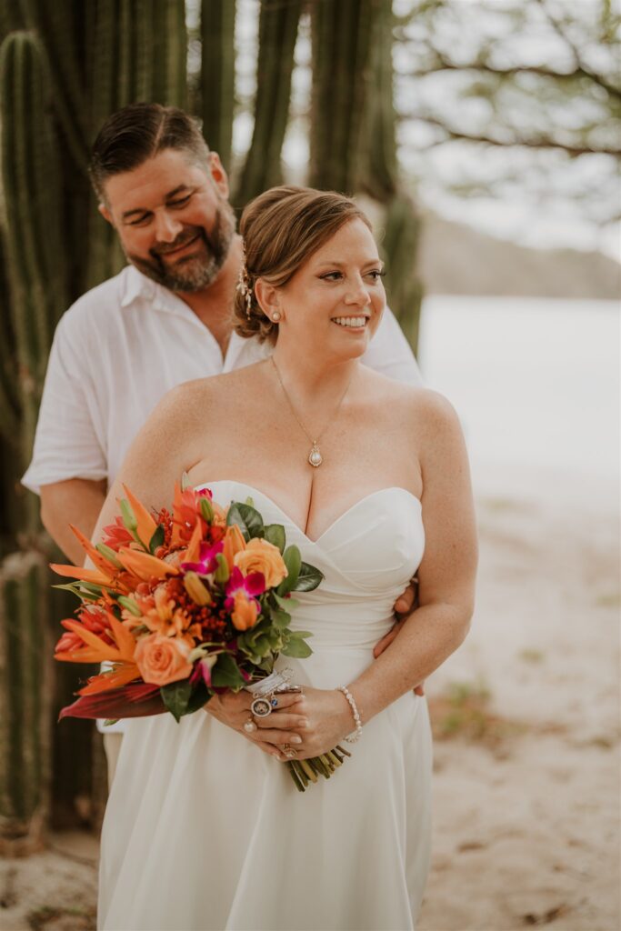 Real Destination Wedding Couple Jenn and Dan at Dreams Las Mareas Costa Rica bride and groom with cactus on the beach