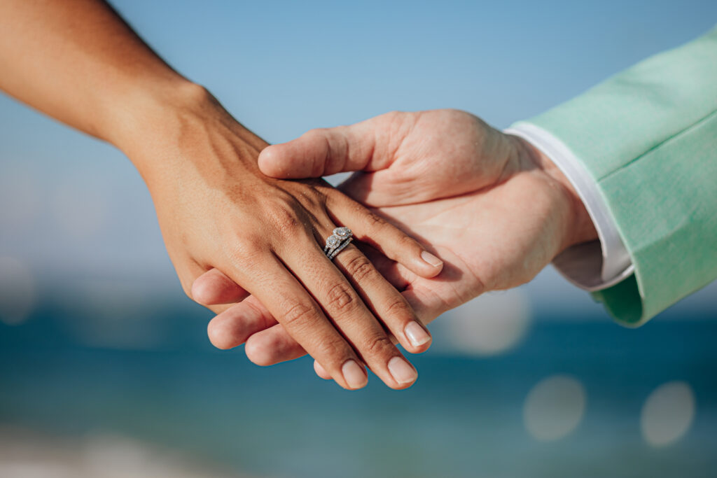 Beach Tropical Destination Wedding Couple hands wedding rings