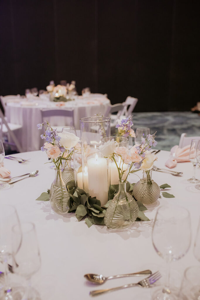 Lauren & Matthew's Destination Wedding at Dreams Vista Cancun | centerpiece with florals