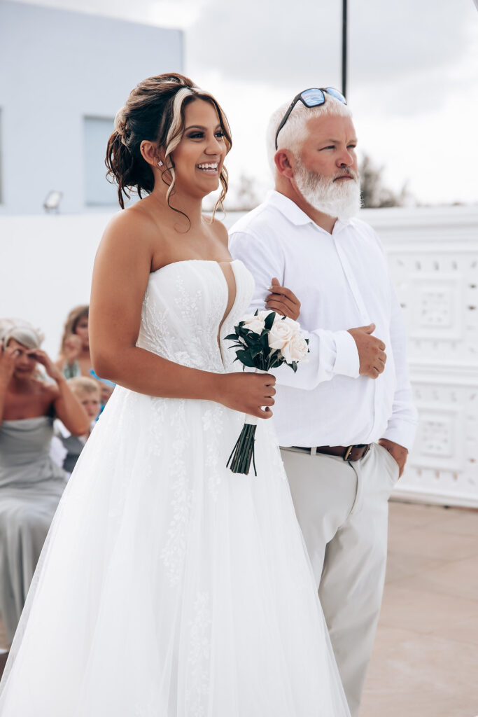 Bride and father walking down the aisle