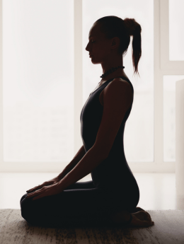 Silhouette of woman with doing yoga