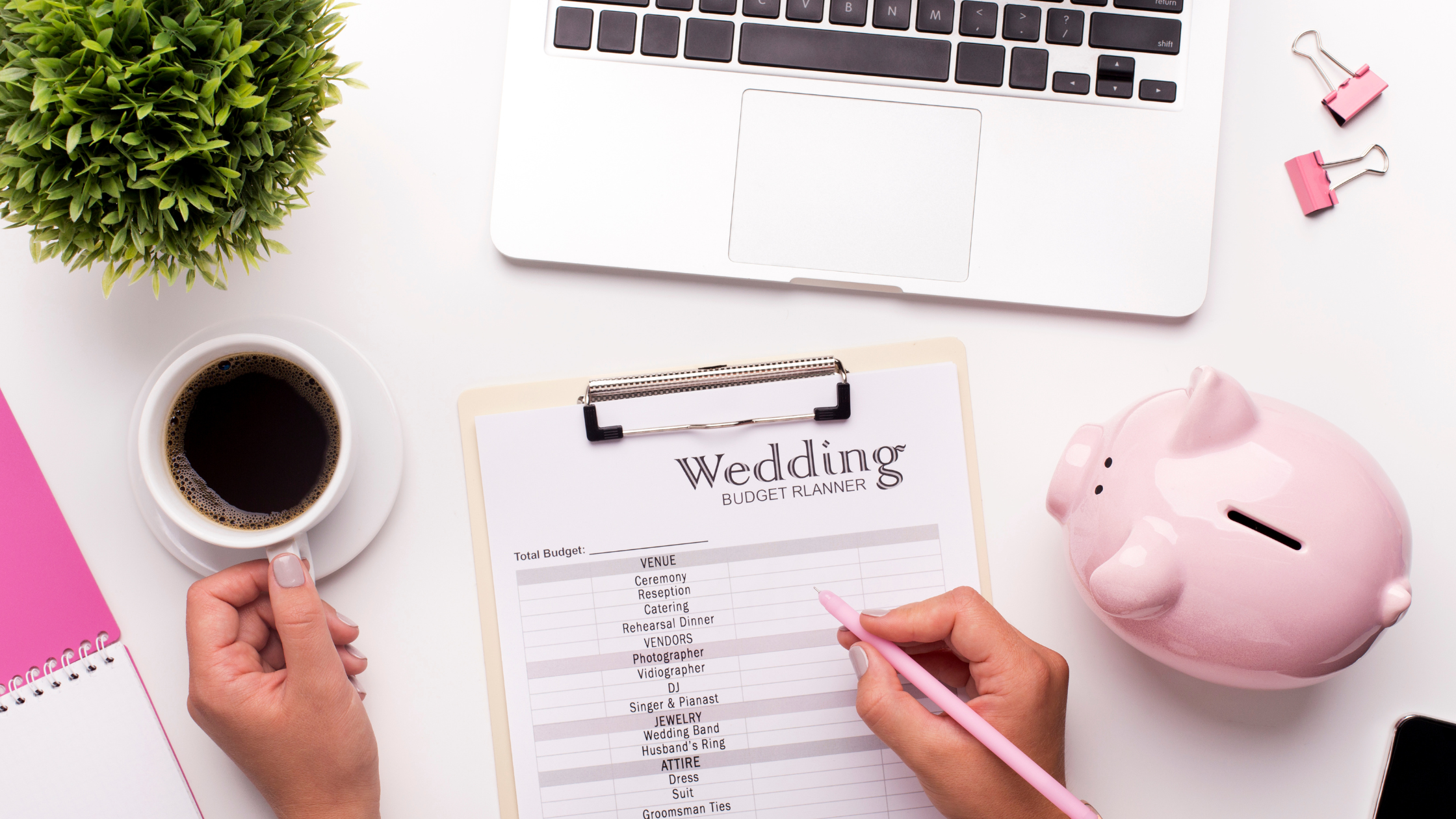 someone writing a wedding budget