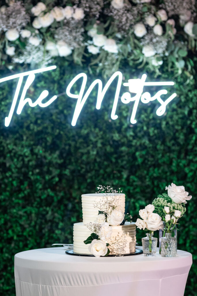 Destination Wedding Cake and Neon Sign