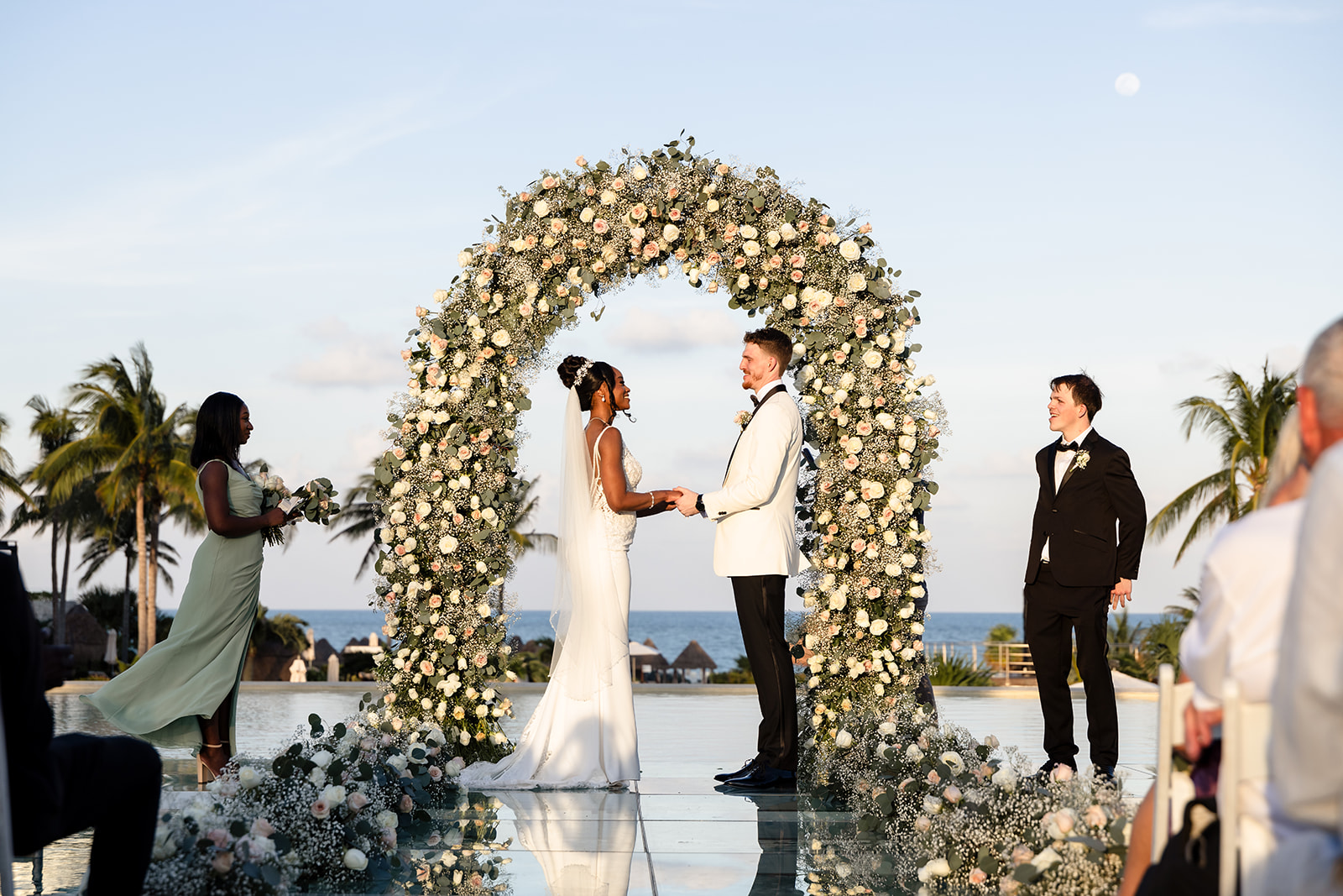 Tajera and Jordan's Destination Wedding Ceremony at Dreams Playa Mujeres Over Water Platform Venue