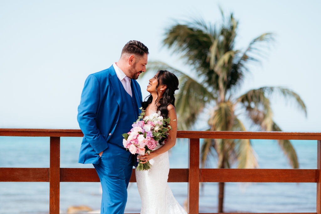destination wedding bride and groom overlooking the ocean