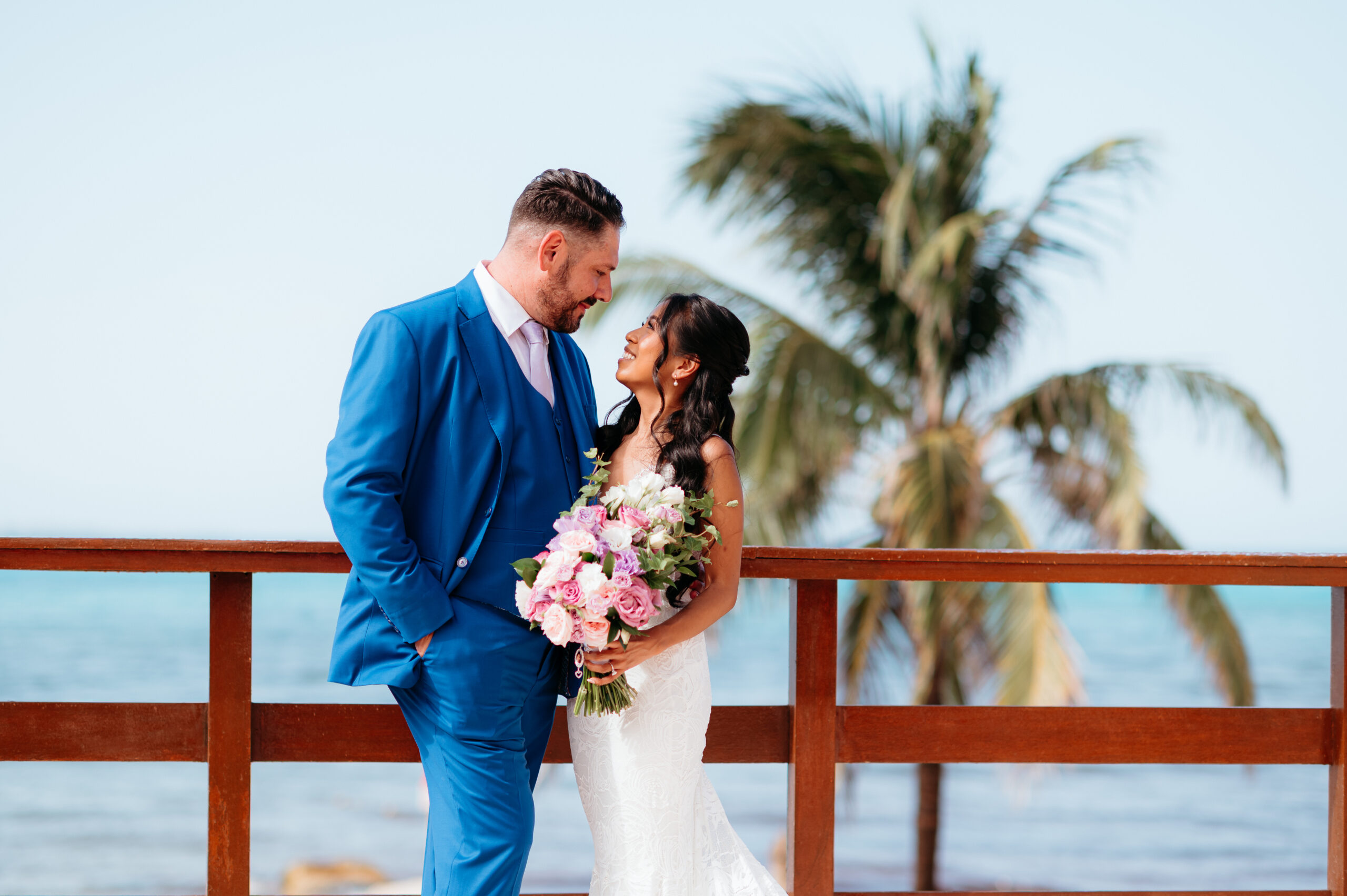 bride and groom overlooking the ocean