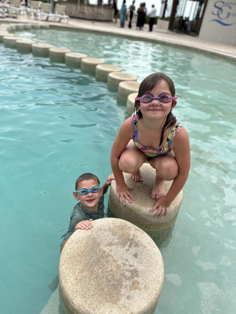 Kids playing on the pool on Mexico Family Vacation 