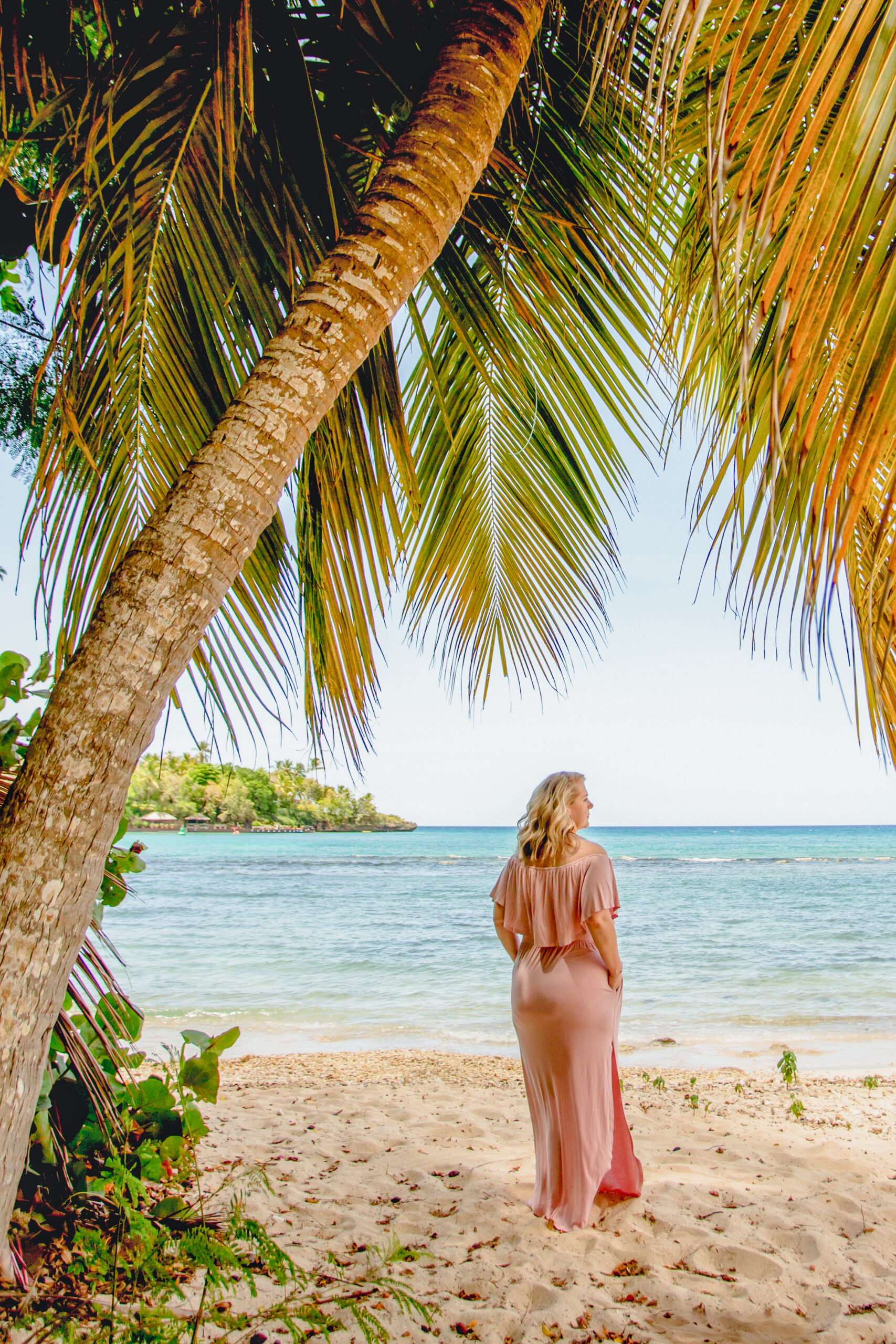 destination wedding planner standing on a beach