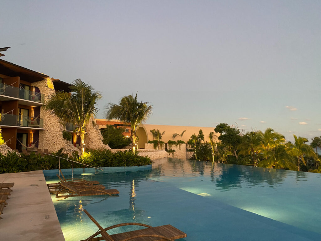 Tranquil infinity pool at sunset, a serene setting for a destination wedding escape or welcome event.