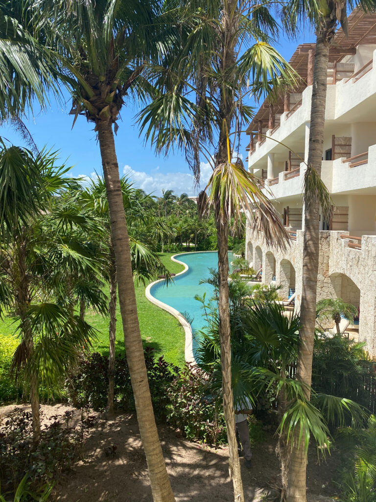 Lush resort view with swim-up suites and tropical landscaping, perfect for a destination wedding stay.