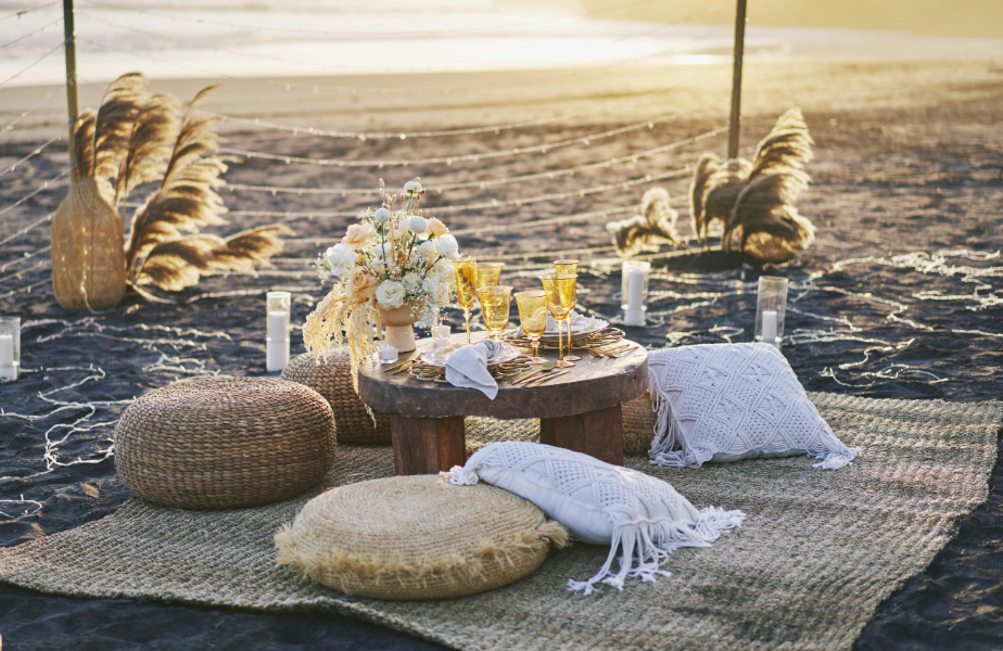 Charming beachside bar cart at golden hour—perfect for casual, stylish beachfront welcome events by the water.