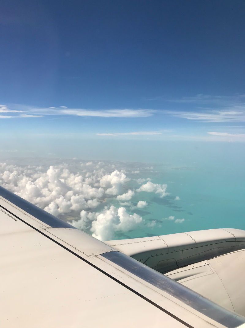 view of the ocean looking out of an airplane window