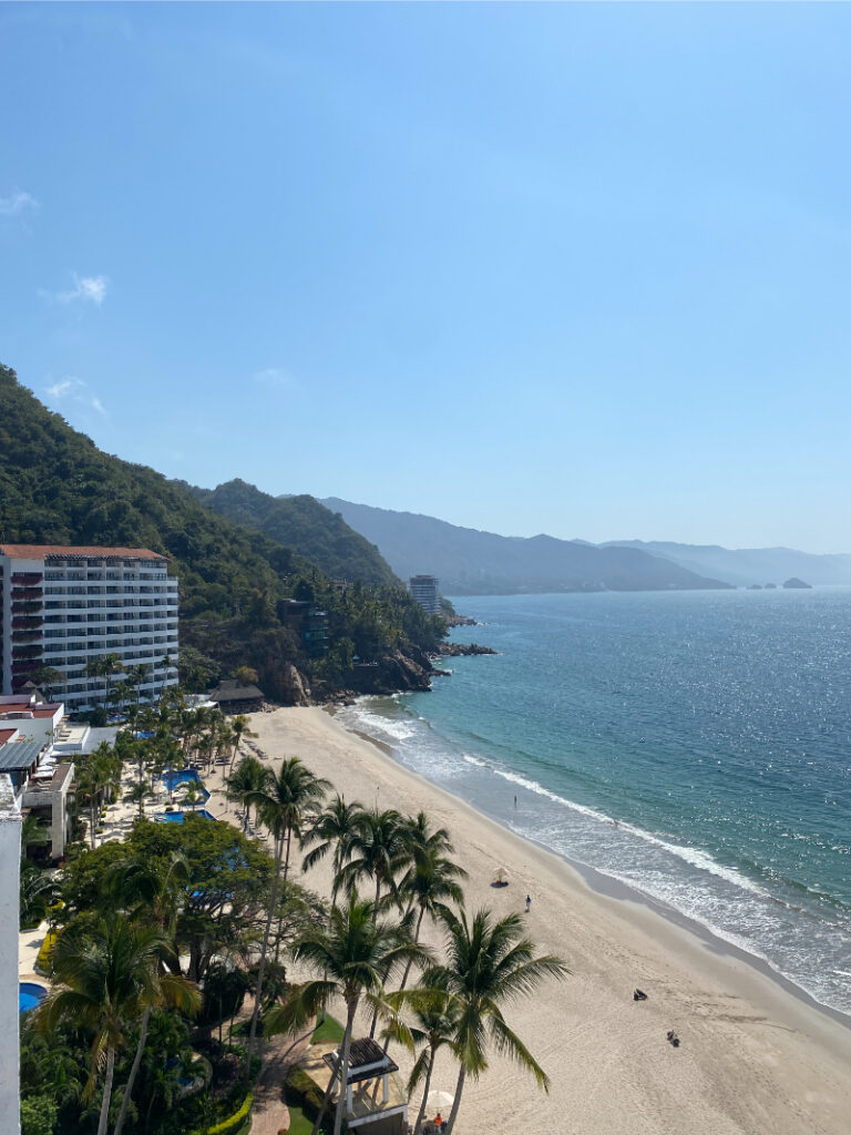 Coastal mountain resort with ocean views and sandy beach, ideal for destination wedding ideas with scenic backdrops