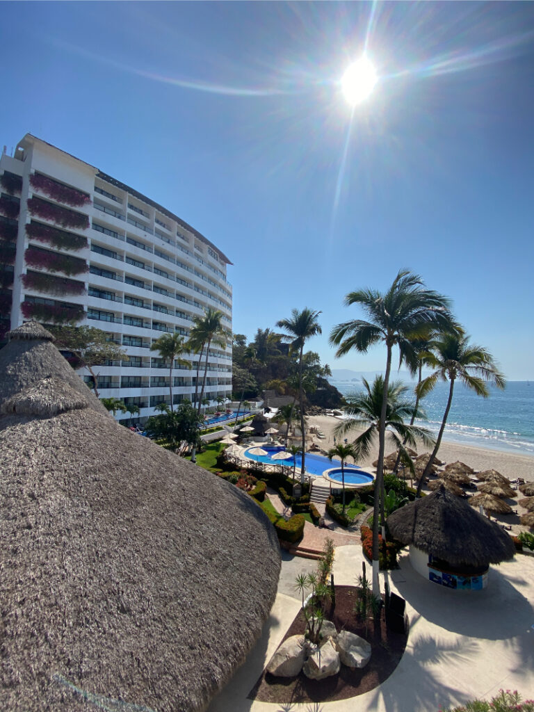 Beachfront all-inclusive resort with palm trees and ocean views, perfect for destination wedding ideas in Mexico