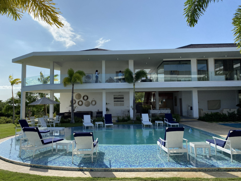 Modern villa with pool and lounge seating, perfect for private destination wedding ideas in tropical settings