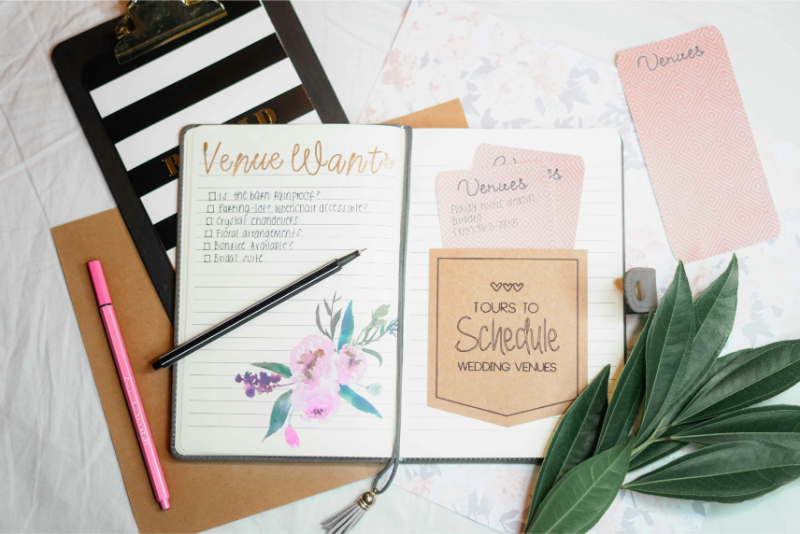 Flat lay of wedding planning notebook, venue checklist, and decor details, organized for a stress free wedding planning process