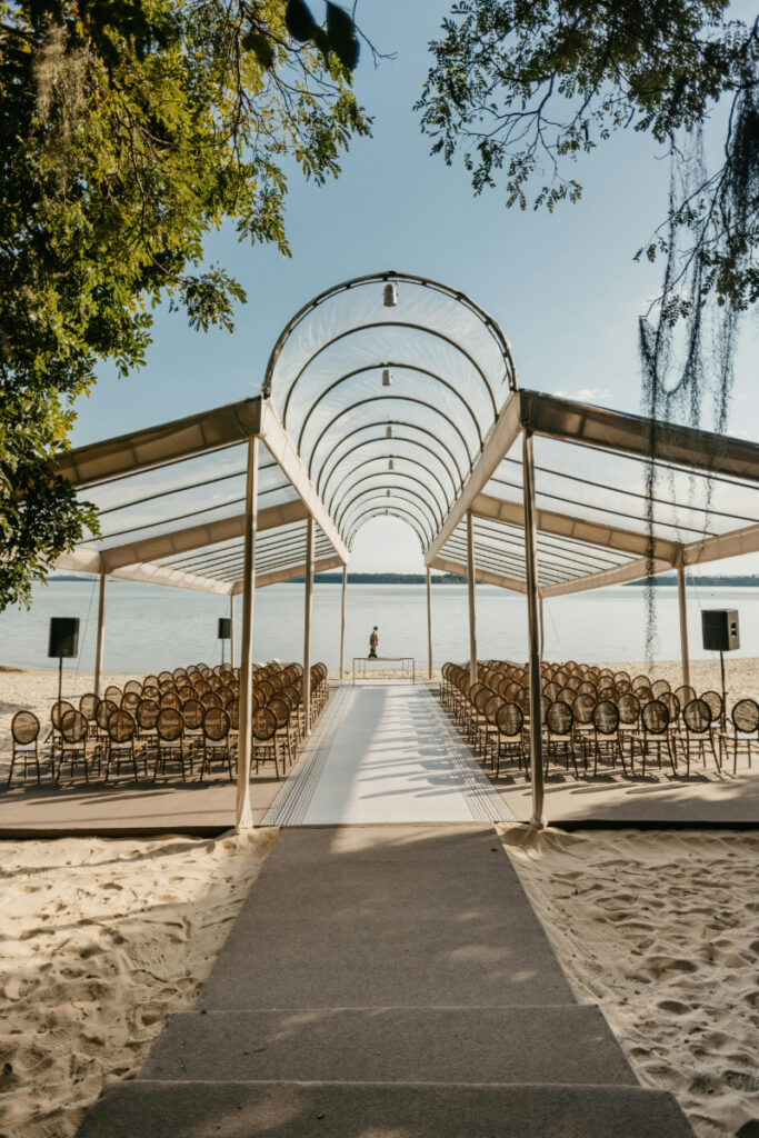 Beach wedding ceremony setup with canopy and chairs, elegant destination wedding budget breakdown inspiration