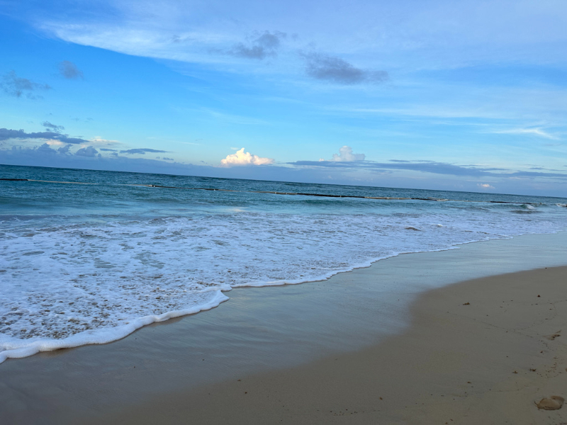 Peaceful beach shoreline at sunset in the Dominican Republic, perfect for a destination wedding celebration.