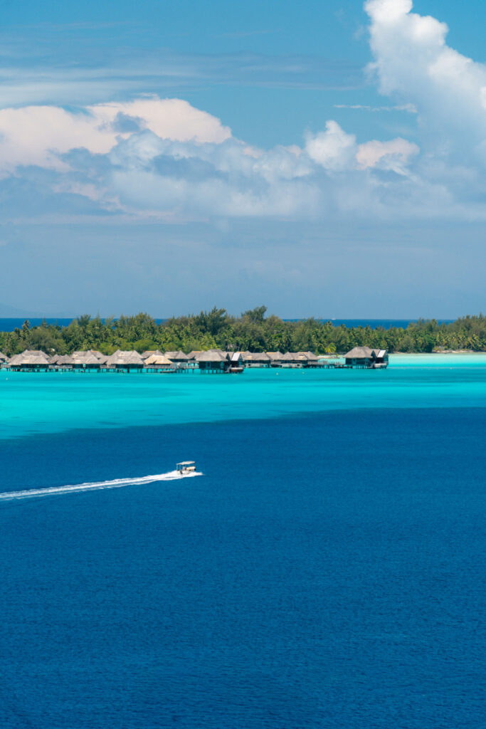 Overwater bungalows in turquoise waters illustrate how average honeymoon cost increases for luxury destinations.
