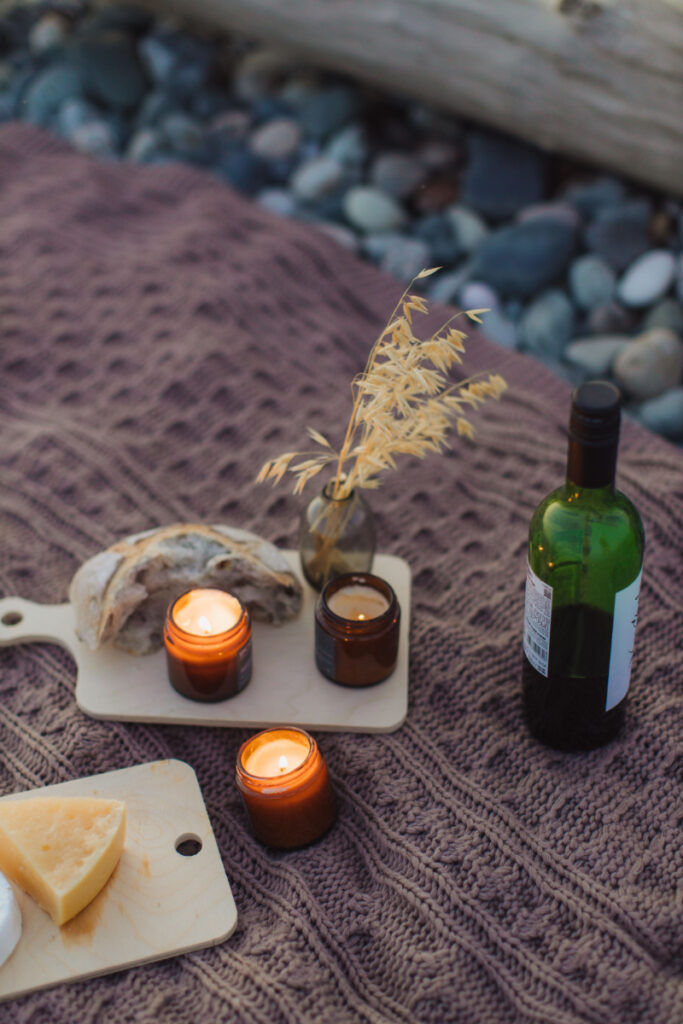 Romantic picnic with wine and candles highlights experiences that can influence average honeymoon cost.