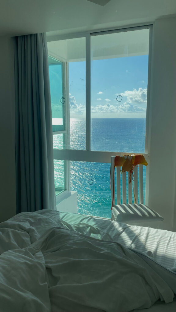 Bright ocean view from a beachfront resort room, showcasing the relaxing scenery found in many top honeymoon destinations.